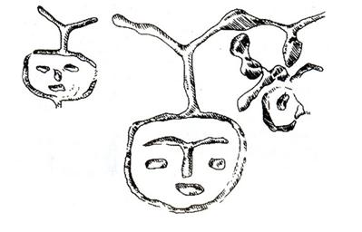 Hình 4: Hình mặt người khắc trên vách hang Đồng Nội